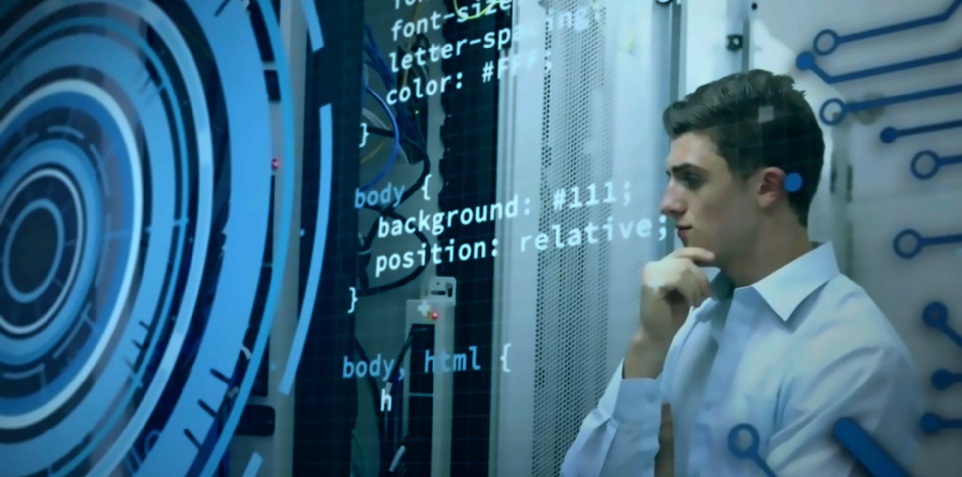 Finance professional reviewing automated reporting system on multiple screens